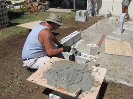 Dan laying block on the new concrete